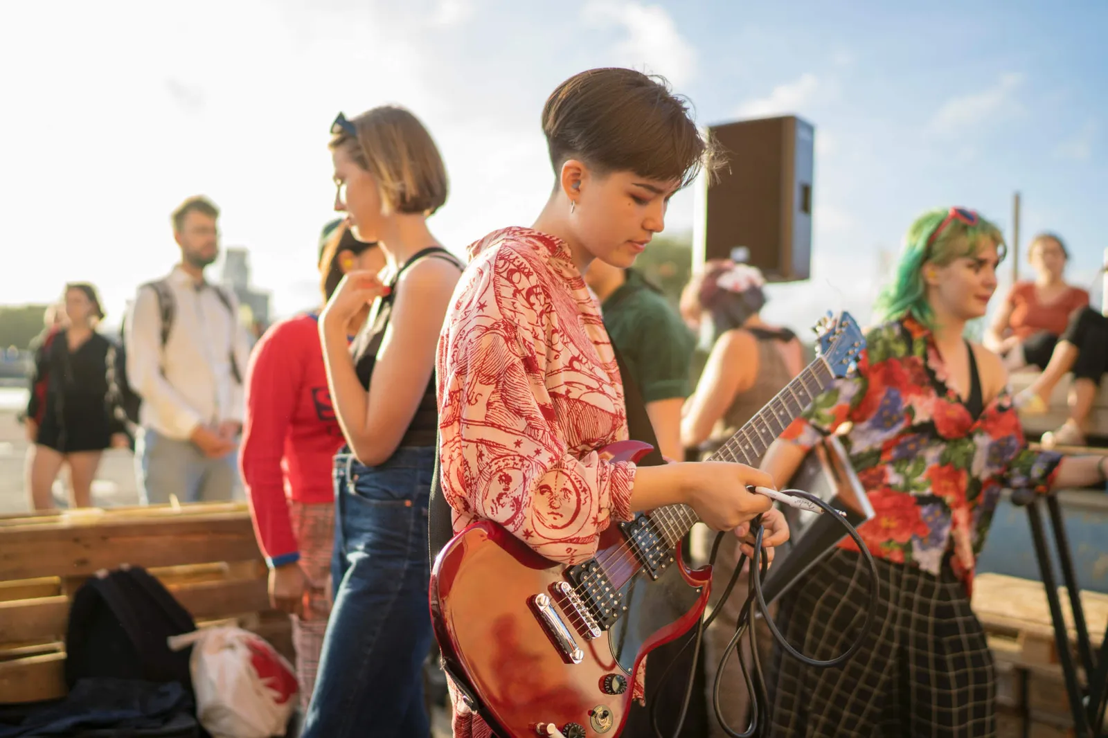 Bass player in plaid shirt